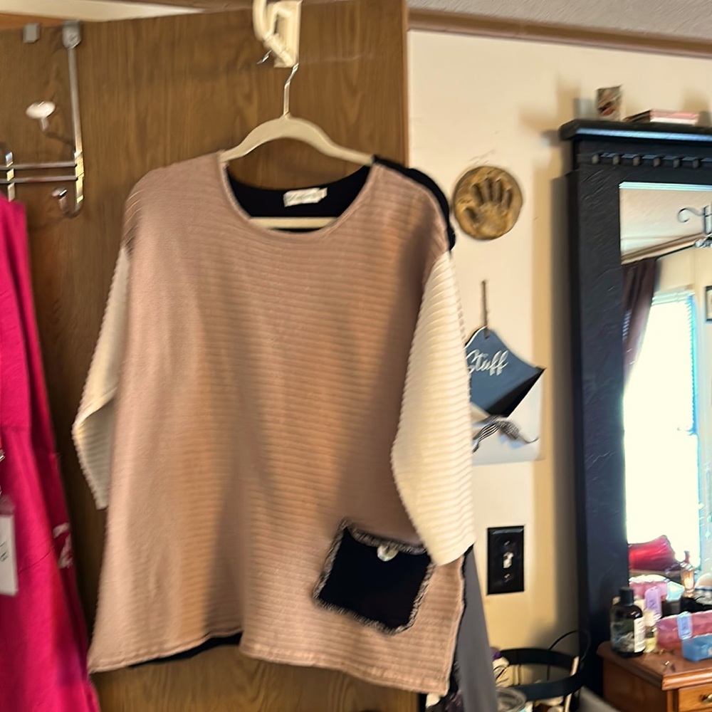 Tan, black, and cream sweater.  Size medium.